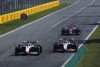AUTODROMO NAZIONALE MONZA, ITALY - SEPTEMBER 11: Kevin Magnussen, Haas VF-22, leads Mick Schumacher, Haas VF-22, and Valtteri Bottas, Alfa Romeo C42 during the Italian GP at Autodromo Nazionale Monza on Sunday September 11, 2022 in Monza, Italy. (Photo by Zak Mauger / LAT Images)